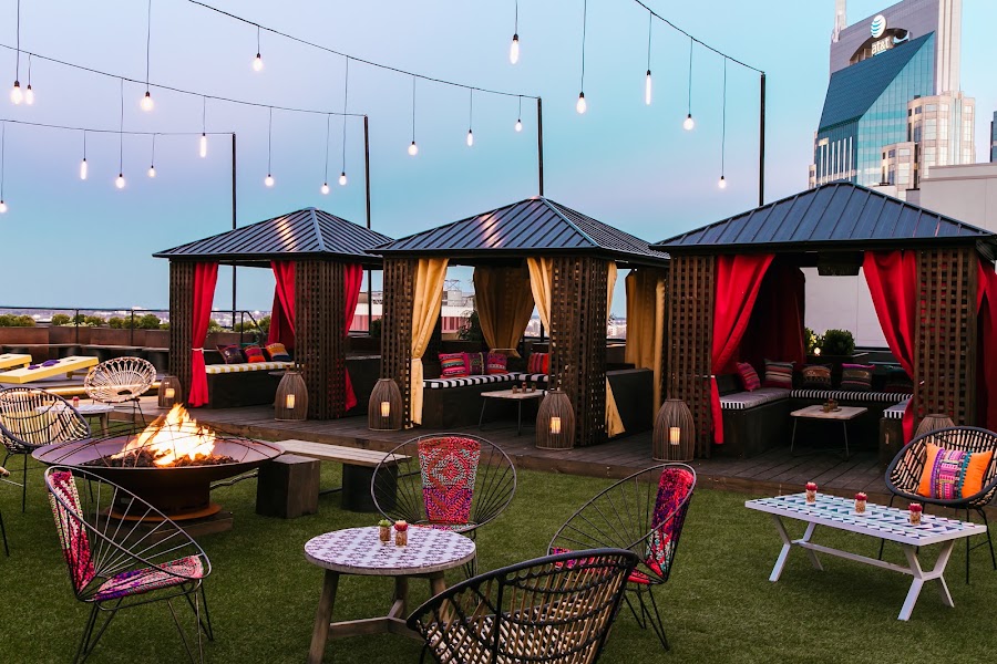 Bobby Hotel rooftop lounge with cabanas and fire pit, Nashville