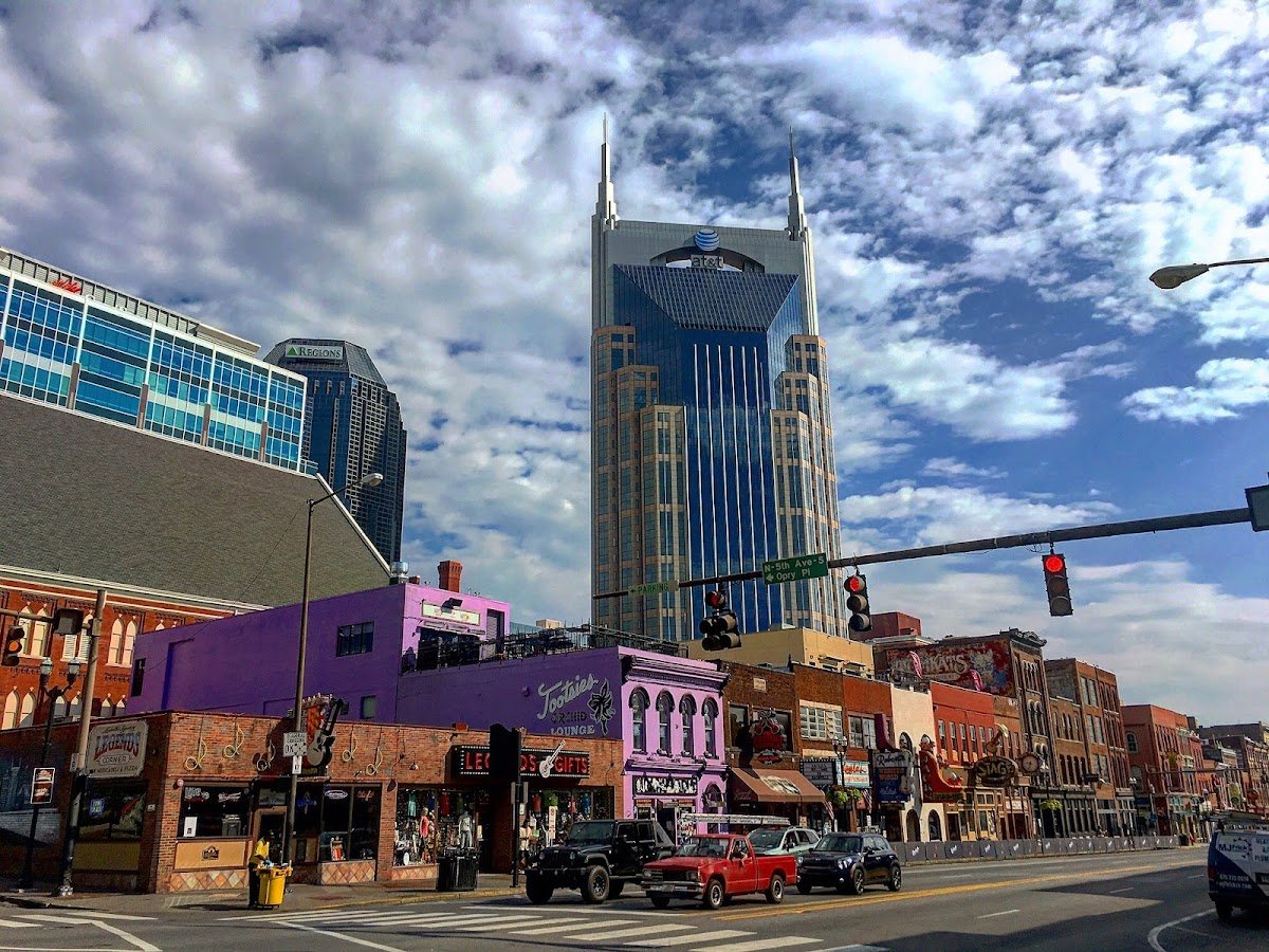 Lower Broadway in Nashville with the downtown skyline behind it
