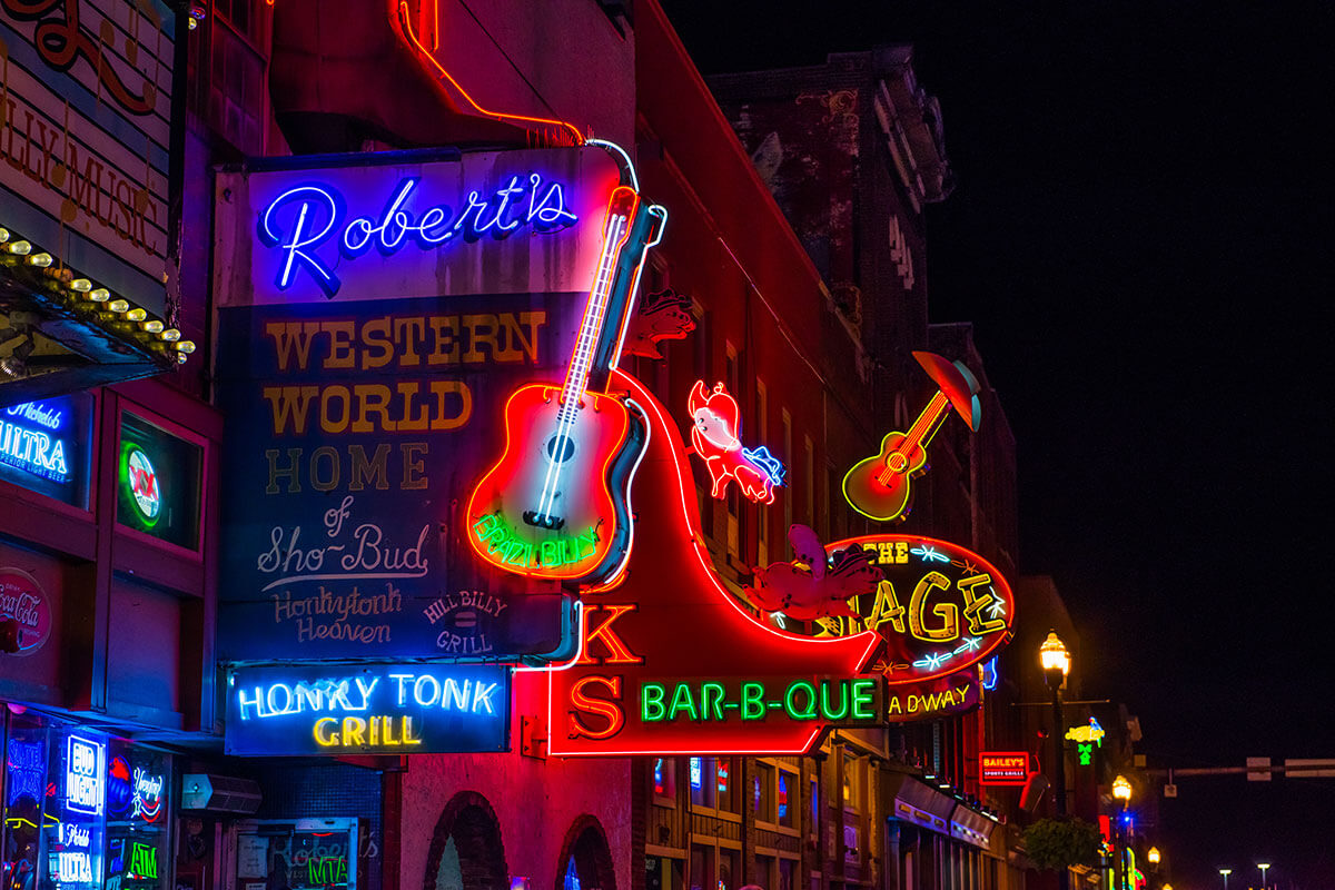 Neon signs over Lower Broadway in Nashville at night